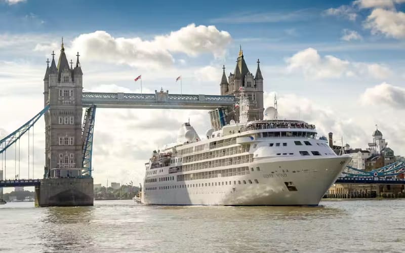 Cruise ship passing under Tower Bridge.